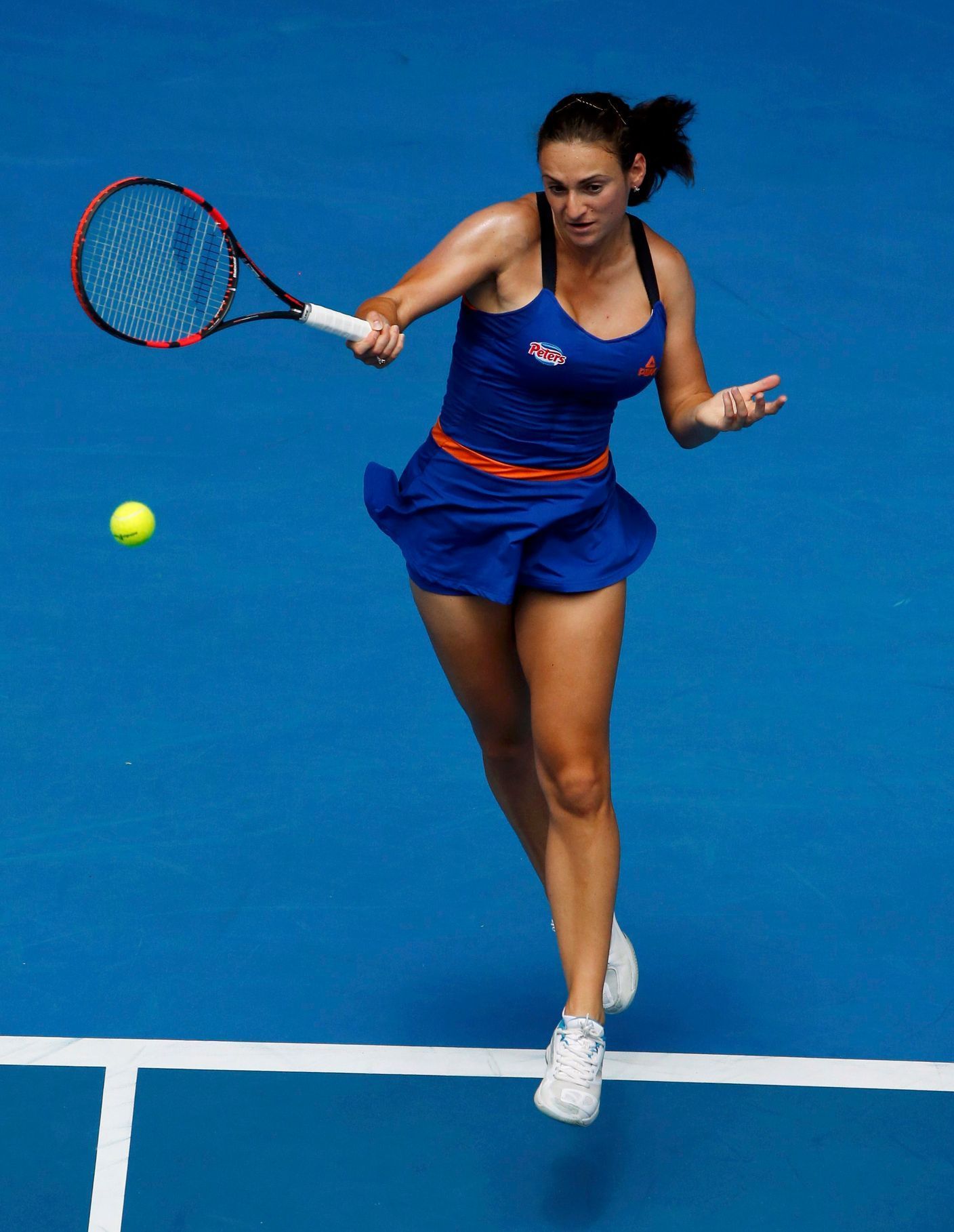 Vesna Dolonc of Serbia hits a return to Serena Williams of the U.S. during their women's singles match at the Australian Open 2014 tennis tournament in Melbourne