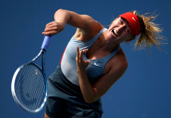 Maria Sharapova of Russia serves to Caroline Wozniacki of Denmark during their match at the 2014 U.S. Open tennis tournament in New York