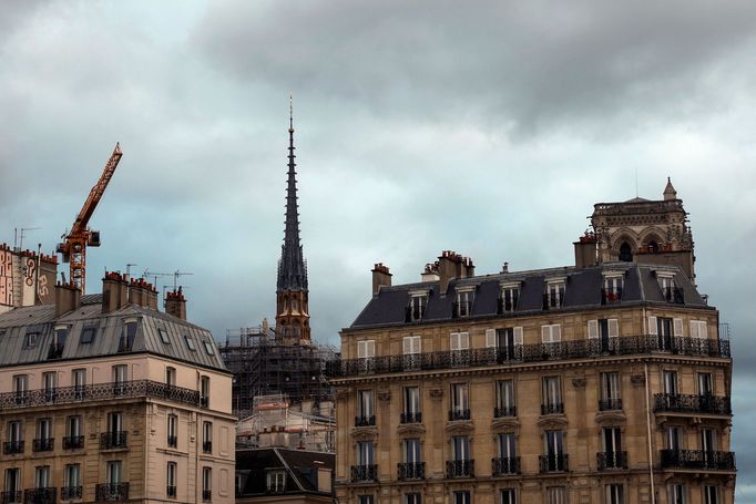 A view shows the new spire, surmounted by the rooster and the cross, of the Notre-Dame de Paris Cathedral, which was ravaged by a fire in 2019, as restoration works conti