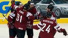 Latvia's Kaspars Daugavins (C) celebrates his goal against Finland with team mates during the first period of their men's ice hockey World Championship group B game at Mi