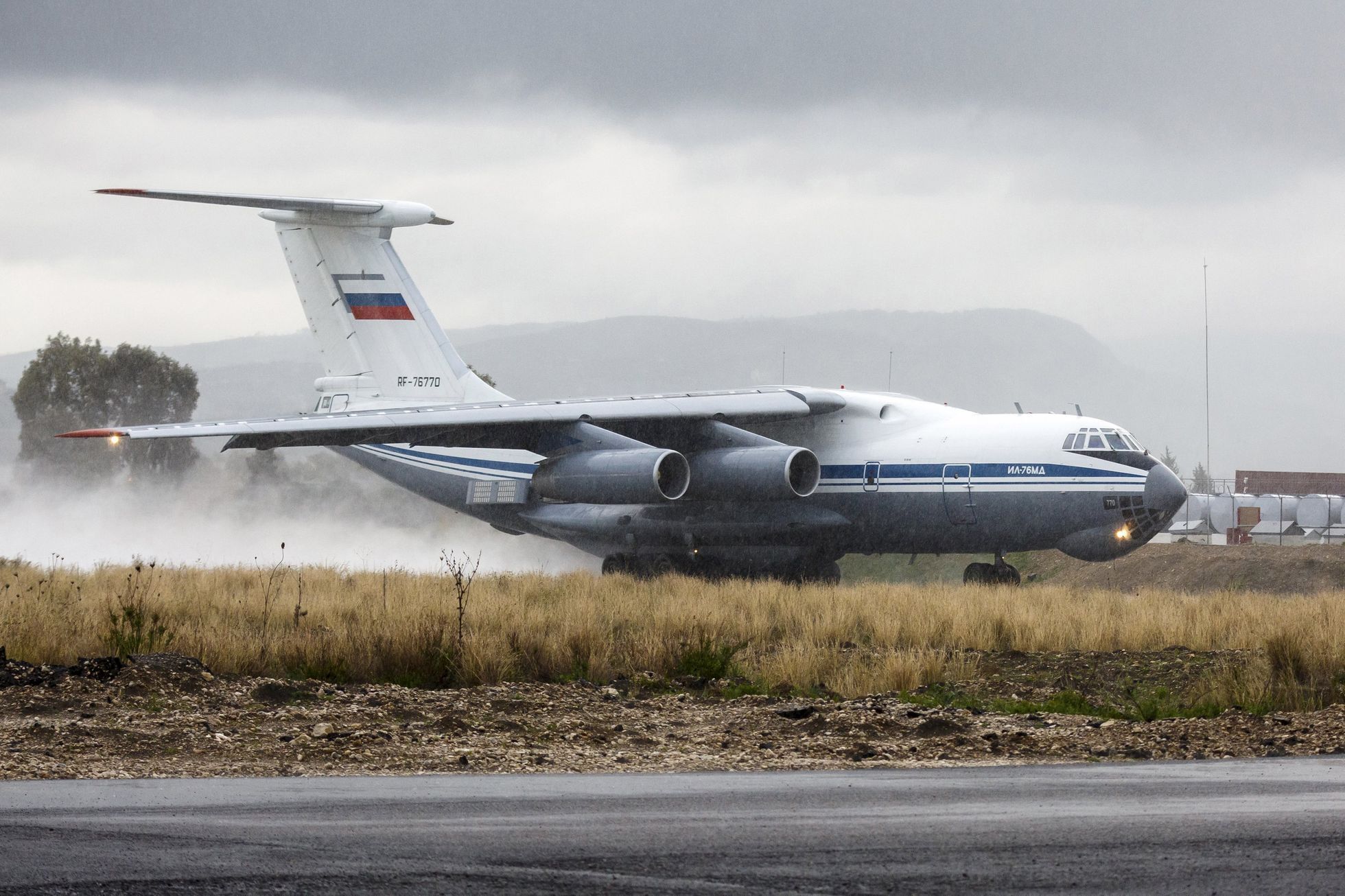 Russian Ilyushin Il-76 military transport aircraft is seen on runway before taking off at Hmeymim airbase
