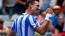 Tomas Berdych of Czech Republic celebrates defeatind Damir Dzumhur of Bosnia and Herzegovina in their men's singles match at the Australian Open 2014 tennis tournament in