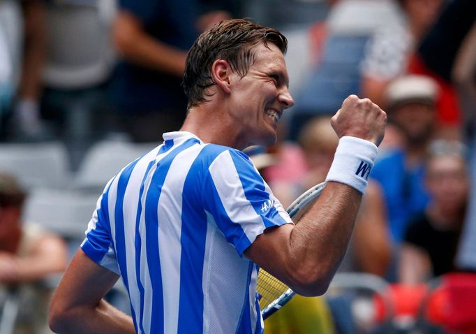 Tomas Berdych of Czech Republic celebrates defeatind Damir Dzumhur of Bosnia and Herzegovina in their men's singles match at the Australian Open 2014 tennis tournament in