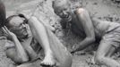 Tourists play in mud during the opening day of the Boryeong Mud Festival at Daecheon beach in Boryeong, about 190 km (118 miles) southwest of Seoul, July 14, 2012. About 2 to 3 million domestic and international tourists visit the beach during the annual festival, according to the festival organisation. REUTERS/Lee Jae-Won (SOUTH KOREA - Tags: SOCIETY TRAVEL) Published: Čec. 14, 2012, 1:34 odp.