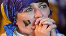 A fan of Bosnia and Herzegovina reacts after Argentina scores a goal during the 2014 World Cup soccer match, at the main square in Sarajevo June 16, 2014. Argentina won 2