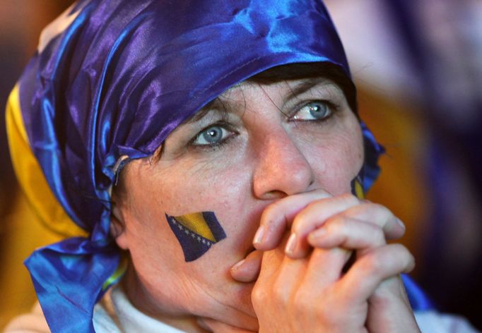 A fan of Bosnia and Herzegovina reacts after Argentina scores a goal during the 2014 World Cup soccer match, at the main square in Sarajevo June 16, 2014. Argentina won 2