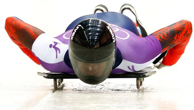 Russia's Alexander Tretiakov speeds down the track during a men's skeleton training at the Sanki sliding center in Rosa Khutor, a venue for the 2014 Sochi Winter Olympics