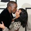 Kanye West and Kim Kardashian kiss on arrival at the 57th annual Grammy Awards in Los Angeles