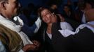 Relatives of a devotee who is believed to be possessed by evil spirits take off her jewellery before performing rituals at Guru Deoji Maharaj temple during a ghost fair at Malajpur village in Betul district in the central Indian state of Madhya Pradesh January 26, 2013. People from across India come to this fair to be exorcised of �evil spirits�. They are usually brought by relatives and they are most often women. The exorcism involves running around the temple courtyard to make the 'ghost' weak then being beaten by a priest with a broom. Picture taken January 26, 2013. REUTERS/Danish Siddiqui (INDIA - Tags: SOCIETY RELIGION) ATTENTION EDITORS: PICTURE 16 OF 24 FOR PACKAGE 'INDIAN GHOSTBUSTERS' SEARCH 'INDIA GHOST' FOR ALL IMAGES Published: Úno. 5, 2013, 5:10 dop.