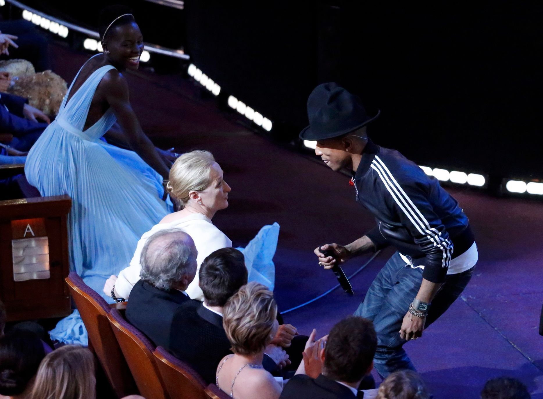 Pharrell Williams performs in front of actress Meryl Streep at the 86th Academy Awards in Hollywood