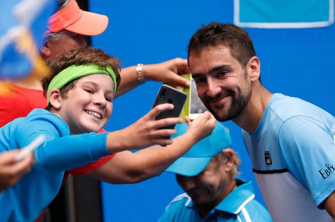 Tennis - Australian Open - Second Round - Melbourne Park, Melbourne, Australia, January 16, 2019. Croatia's Marin Cilic interacts with a fan after winning the match again