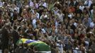 The coffin of architect Oscar Niemeyer leaves the Planalto Palace in Brasilia December 6, 2012. Niemeyer, a towering patriarch of modern architecture who shaped the look of modern Brazil and whose inventive, curved designs left their mark on cities worldwide, died late on Wednesday. He was 104. Niemeyer had been battling kidney and stomach ailments in a Rio de Janeiro hospital since early November. His death was the result of a lung infection developed this week, the hospital said, little more than a week before he would have turned 105. REUTERS/Paulo Whitaker (BRAZIL - Tags: SOCIETY OBITUARY) Published: Pro. 6, 2012, 10:22 odp.