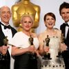 J.K. Simmons, Patricia Arquette, Julianne Moore and Eddie Redmayne pose with their Oscars backstage at the 87th Academy Awards in Hollywood, California