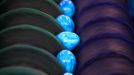 Eggs roll on a conveyor belt through dye rollers in the Beham egg dye-works in Thannhausen, Germany, 30 March 2012. Its peak season at the dyeworks shortly before Easter. Around 180,000 eggs are boiled and dyed here daily. Photo: Karl-Josef Hildenbrand