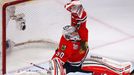 Chicago Blackhawks goalie Corey Crawford makes a save against the Boston Bruins during the first period in Game 1 of their NHL Stanley Cup Finals hockey series in Chicago