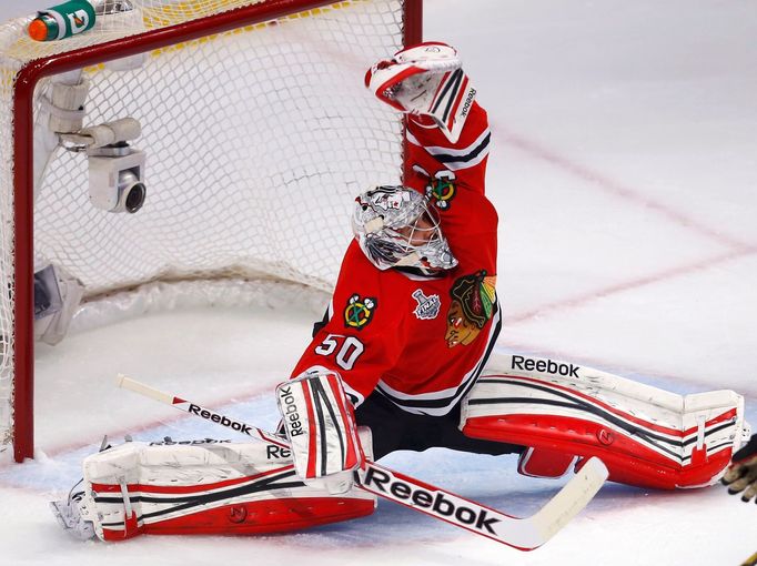 Chicago Blackhawks goalie Corey Crawford makes a save against the Boston Bruins during the first period in Game 1 of their NHL Stanley Cup Finals hockey series in Chicago