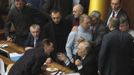 Ukrainian deputies surround speaker Volodymyr Rybak (C, bottom) during a session of parliament in Kiev February 21, 2014. Fighting broke out between deputies in Ukraine's