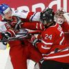 Canada's Dumba battles with Czech Republic's Faksa in front of Canada's goalie Paterson during the third period of their IIHF World Junior Championship ice hockey game in Malmo