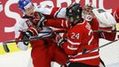 Canada's Dumba battles with Czech Republic's Faksa in front of Canada's goalie Paterson during the third period of their IIHF World Junior Championship ice hockey game in