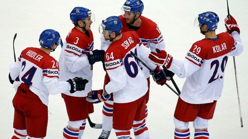 Jiri Novotny of the Czech Republic (top, C) celebrates his goal against Canada with team mates during the third period of their men's ice hockey World Championship group