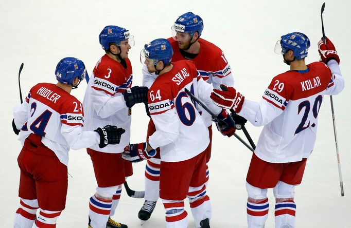 Jiri Novotny of the Czech Republic (top, C) celebrates his goal against Canada with team mates during the third period of their men's ice hockey World Championship group