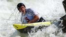 Tyler Hinton takes a breath after going under the water while competing in the men's C1 during the U.S. Olympic trials for whitewater slalom in Charlotte