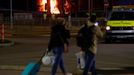 People leave as emergency services respond to a fire in Terminal Car Park 2 at London Luton airport in Luton, Britain, October 11, 2023.  REUTERS/Peter Cziborra