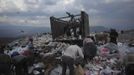 Garbage collectors look for recyclable waste at a municipal dump site in Tegucigalpa