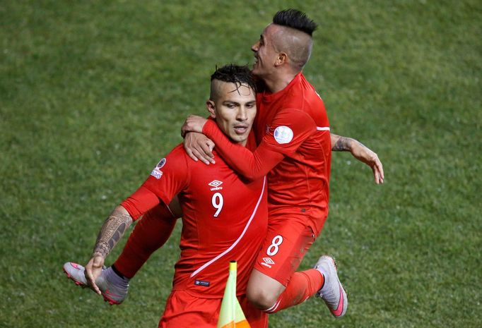 Peru's Paolo Guerrero celebrates his third goal of the game against Bolivia with teammate Christian Cueva during their Copa America 2015 quarter-finals soccer match at Es