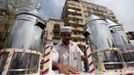 Waleed Ahmed el-Sayed, 31, who received a BA in social services from Assyiut University in 2004, sells juice in Tahrir square in Cairo May 4, 2012. Waleed has been working as a street vendor for almost seven years as he has not found a steady job since his graduation.