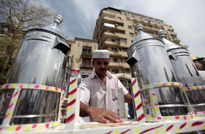 Waleed Ahmed el-Sayed, 31, who received a BA in social services from Assyiut University in 2004, sells juice in Tahrir square in Cairo May 4, 2012. Waleed has been working as a street vendor for almost seven years as he has not found a steady job since his graduation.