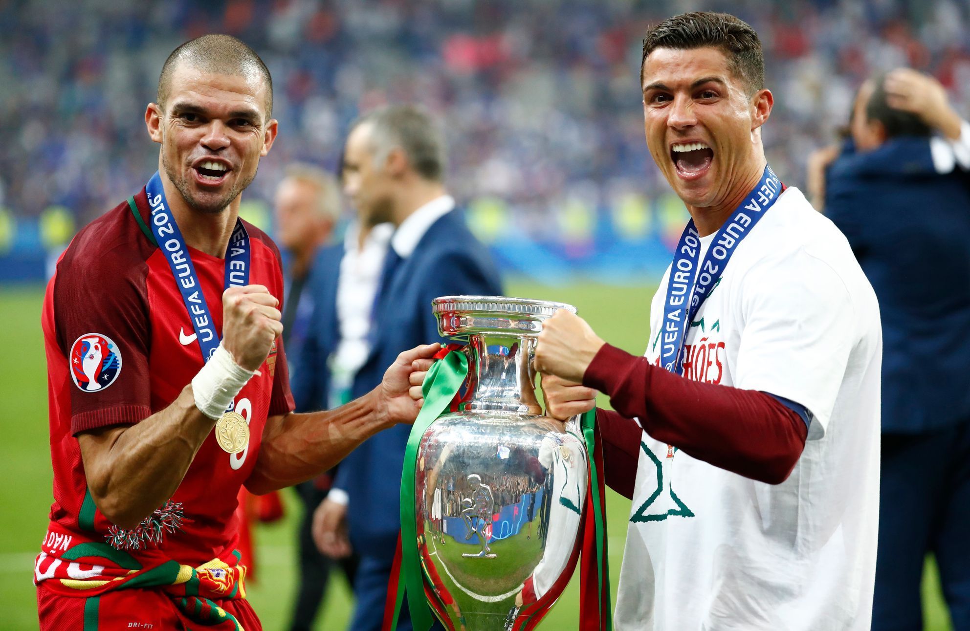 Portugal's Cristiano Ronaldo and Pepe celebrate with the trophy after winning Euro 2016
