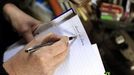 Artist and poet Barry Edgar Pilcher begins to write a poem in his cottage on the Island of Inishfree in County Donegal, May 1, 2012. REUTERS/Cathal McNaughton