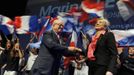 Marine Le Pen and her father Jean appear on stage during campaign rally in Nice