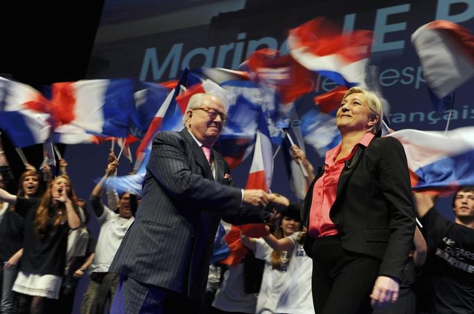 Marine Le Pen and her father Jean appear on stage during campaign rally in Nice