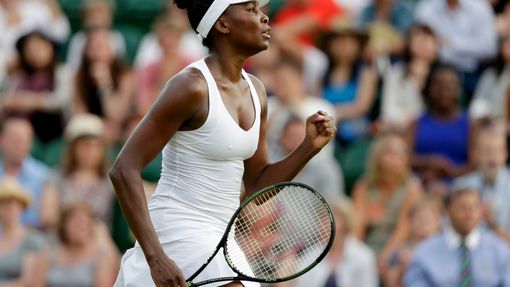 Venus Williams of the U.S.A. celebrates after winning the first set during her match against Yulia Putintseva of Kazakhstan at the Wimbledon Tennis Championships in Londo