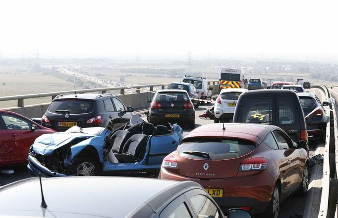 The wreckage of some of the 100 vehicles involved in multiple collisions, which took place in dense fog during the morning rush hour, is seen on the Sheppey Bridge in Kent, east of London