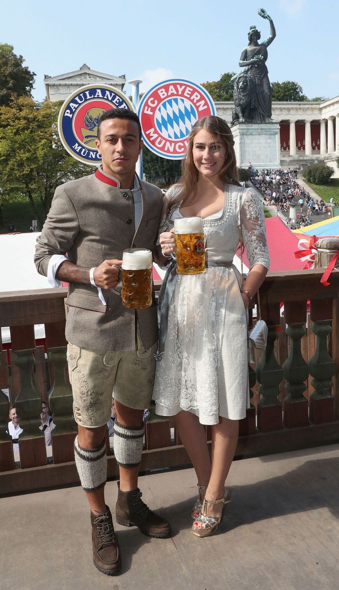 FC Bayern Munich's Thiago and his wife Julia pose during their visit at the Oktoberfest in Munich