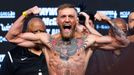 FILE PHOTO: UFC lightweight champion Conor McGregor of Ireland poses on the scale during his official weigh-in at T-Mobile Arena in Las Vegas, Nevada, U.S., August 25, 20