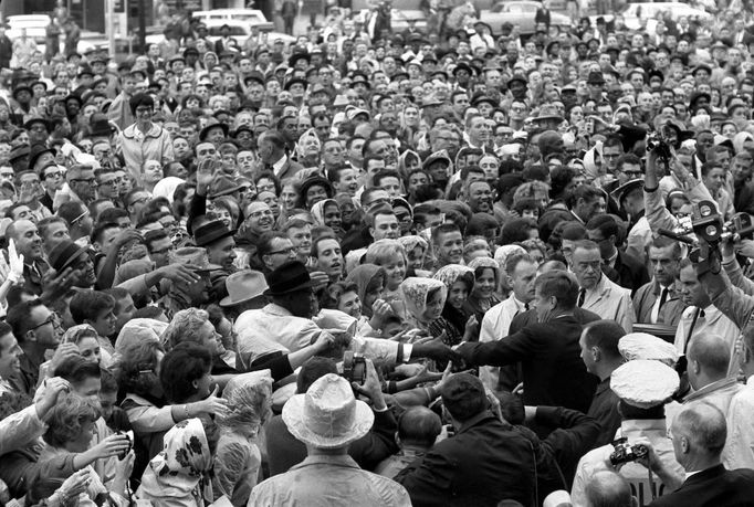 Former U.S. President John F. Kennedy reaches out to the crowd gathered at the Hotel Texas Parking Lot Rally in Fort Worth,Texas, in this handout image taken on November 22, 1963. Friday, November 22, 2013, will mark the 50th anniversary of the assassination of President Kennedy.