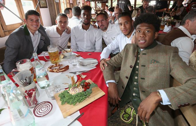 FC Bayern Munich's Rodriguez, Rafinha, Coman, Ribery, Tolisso and Alaba pose during their visit at the Oktoberfest in Munich