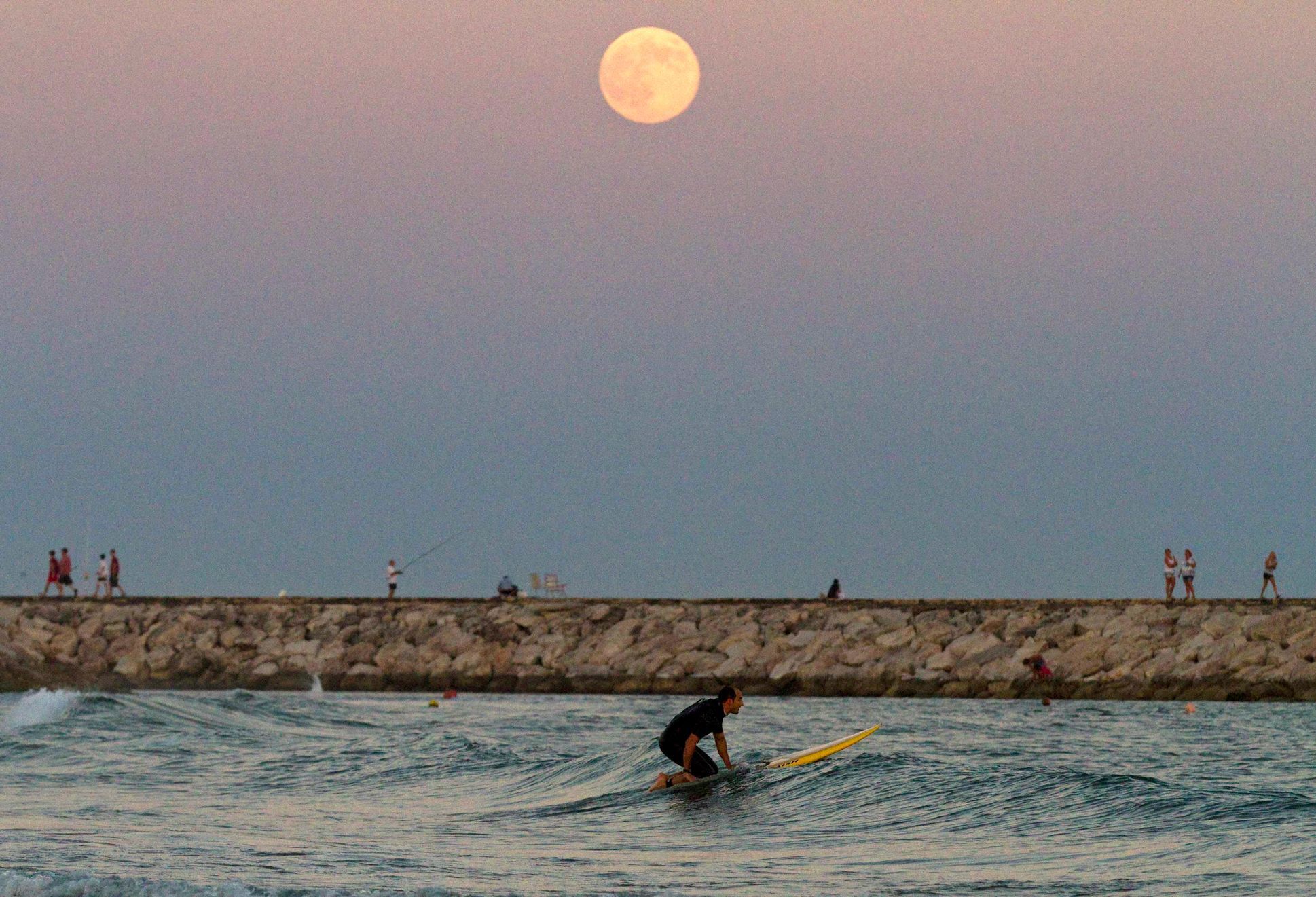 The supermoon rises over the Mediterranean sea at Cabopino beach in southern Spain