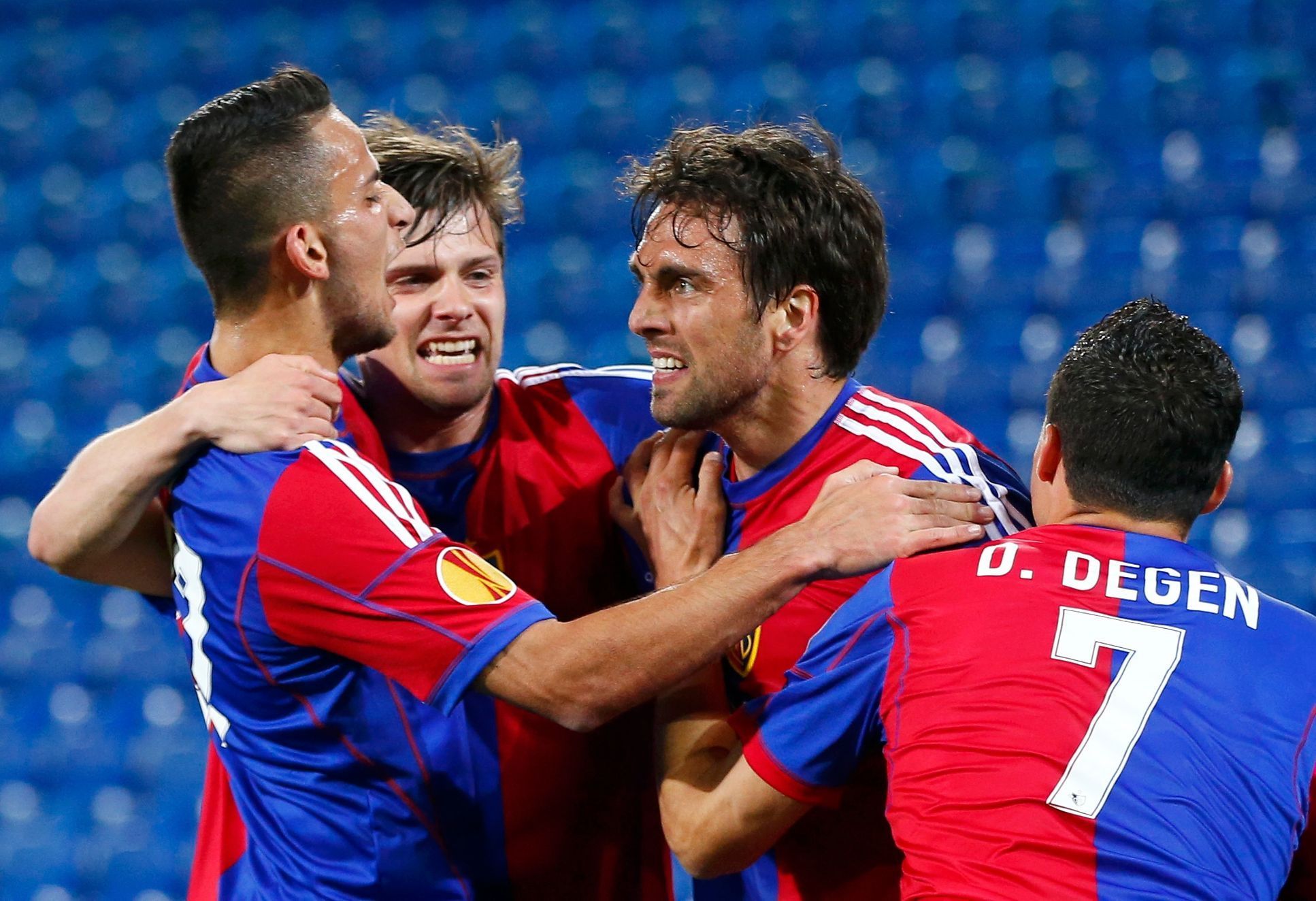 FC Basel's Delgado celebrates with team mates Stocker, Degen and Aliji after scoring a goal against Valencia during their Europa League quarter-final first leg soccer match in St.Jakob-Park stadium in