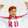 Russia's Victor An celebrates his bronze medal finish in the men's 1,500 metres short track speed skating finals event at the Iceberg Skating Palace during the 2014 Sochi Winter Olympics