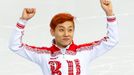 Russia's Victor An celebrates his bronze medal finish in the men's 1,500 metres short track speed skating finals event at the Iceberg Skating Palace during the 2014 Sochi