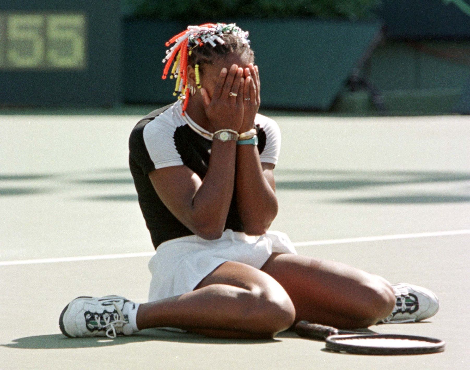 FILE PHOTO: Serena Williams reacts to losing a point in her quarter-final match against top seed and defending champion Martina Hingis