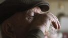 Villager Shamianok drinks vodka during his breakfast in his house at abandoned village of Tulgovichi