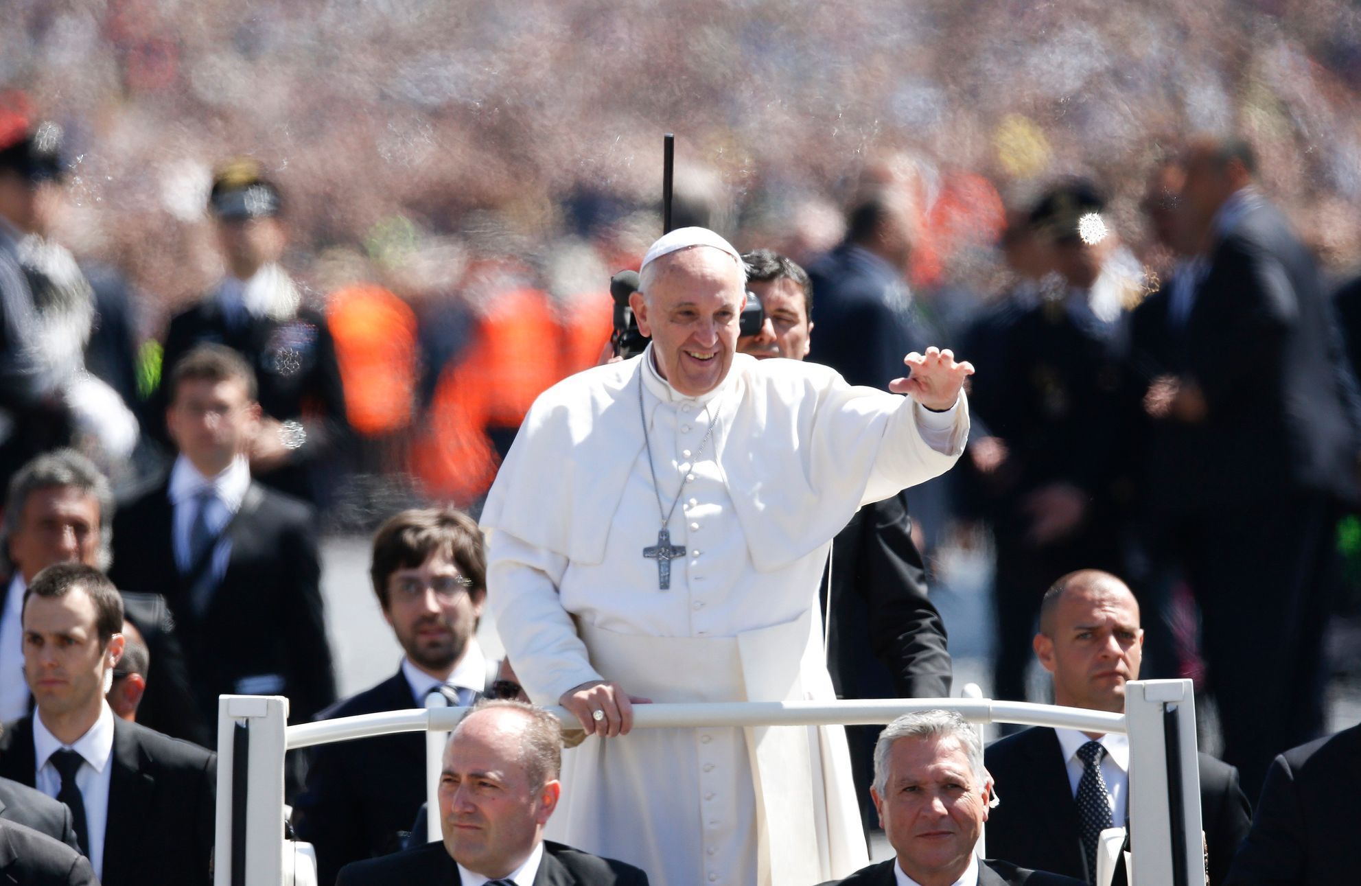 Pope Francis waves as he leads the Easter mass in Saint Peter's Square at the Vatican