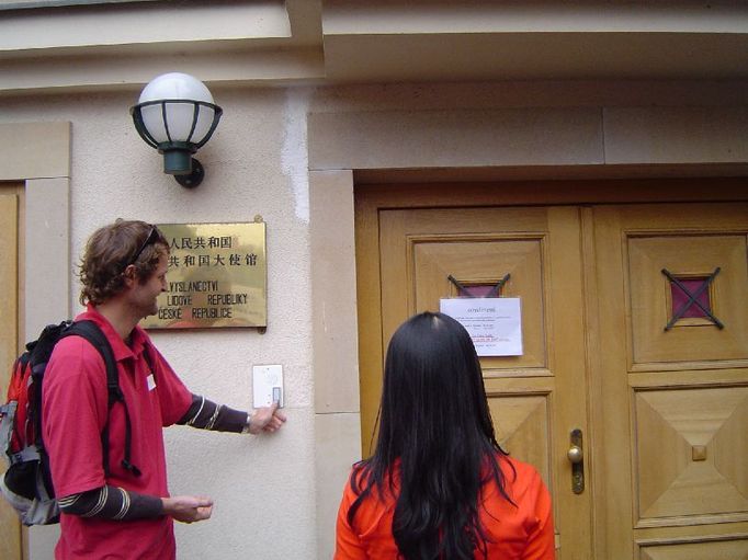 The moment of truth. Jan Líska ringing the embassy doorbell, Sabe Soe ready to hand over the petition.