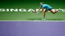 Petra Kvitova of the Czech Republic hits a return to Agnieszka Radwanska of Poland during their WTA Finals singles tennis match at the Singapore Indoor Stadium October 21